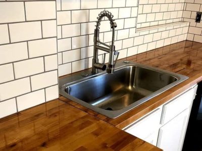 newly installed kitchen sink and countertops by HTS Builders and Allied Remodeling Contractors