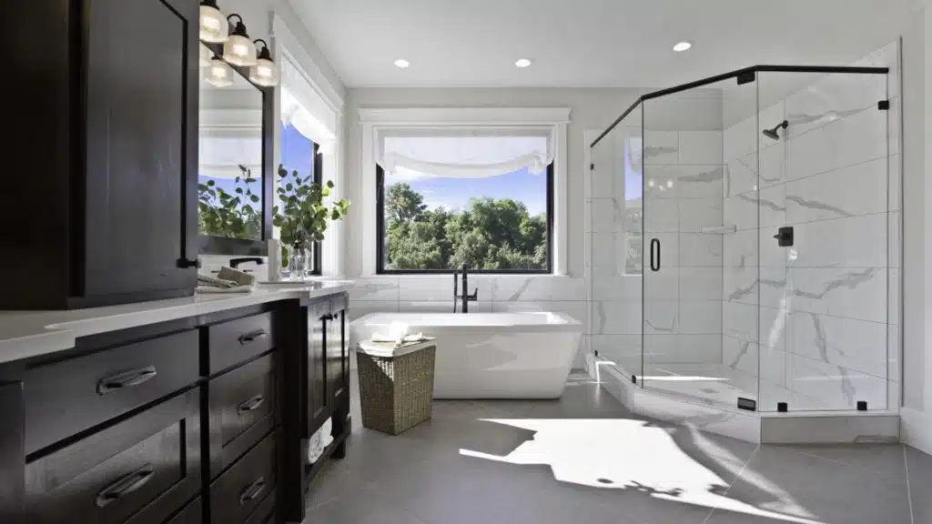 master bathroom with walk in shower with glass doors. 