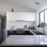 Basic kitchen renovation refacing cabinets, granite countertops, tile backsplash and new sinks, appliances and paint