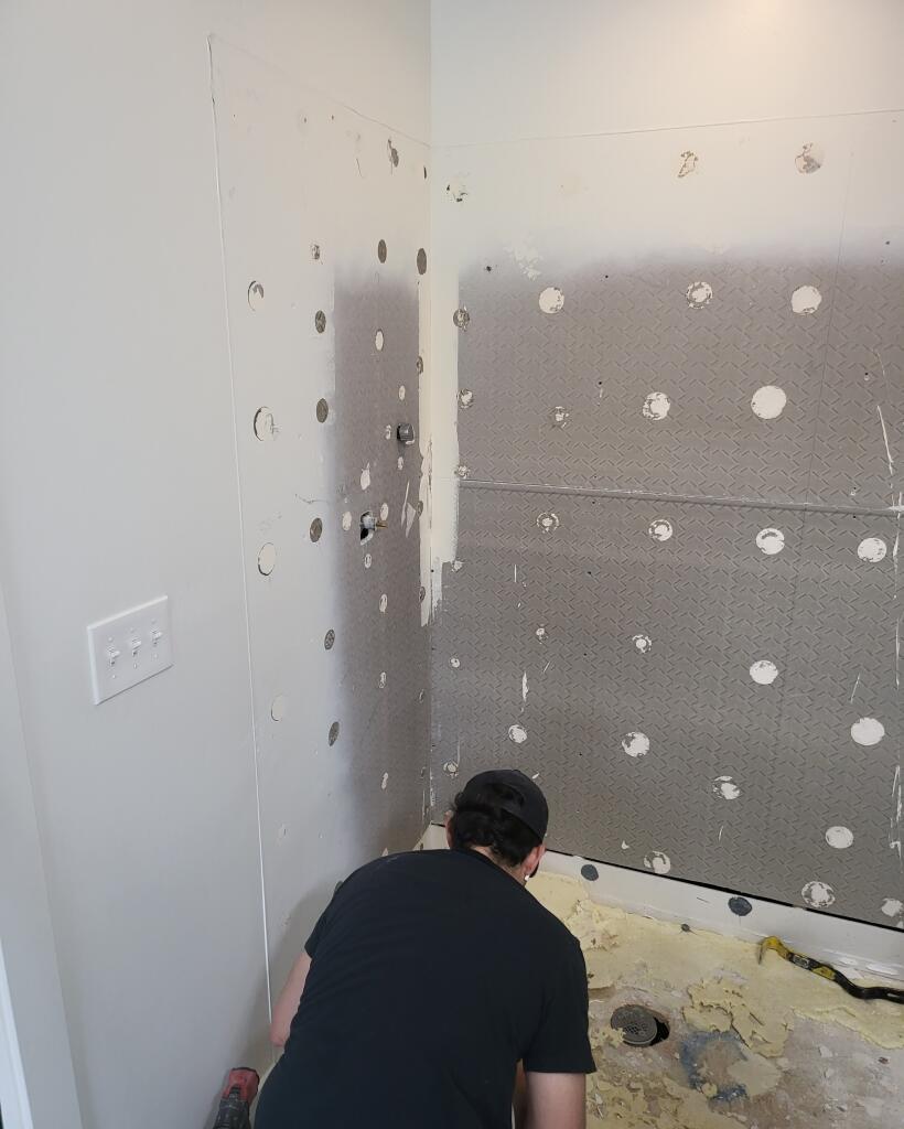 An Allied Remodeling Contractor doing demo for a shower to tub conversion in Lehi, Utah.