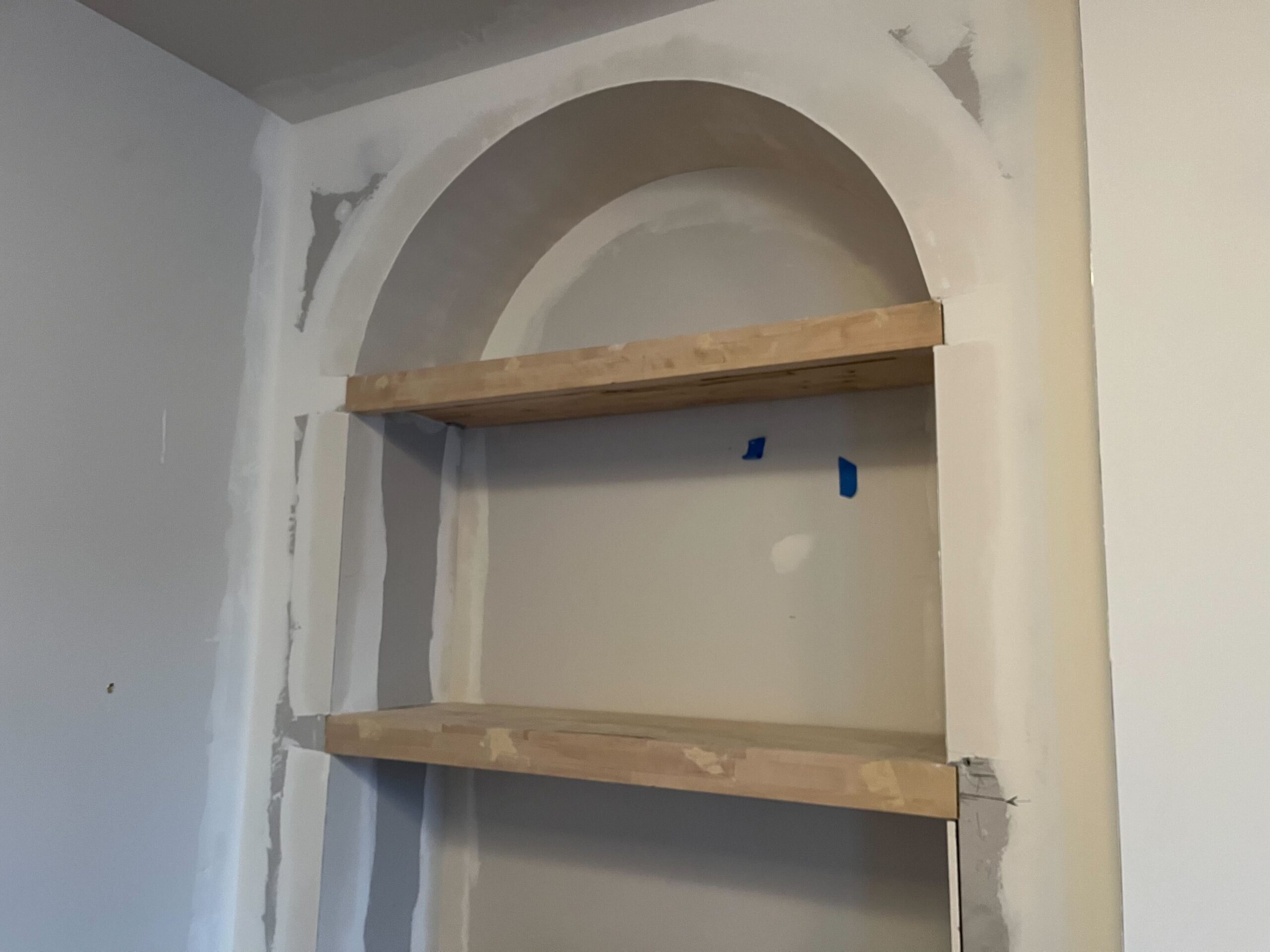 Shelves being added to a custom built-in entertainment center by Allied Remodeling Contractors in Utah County.