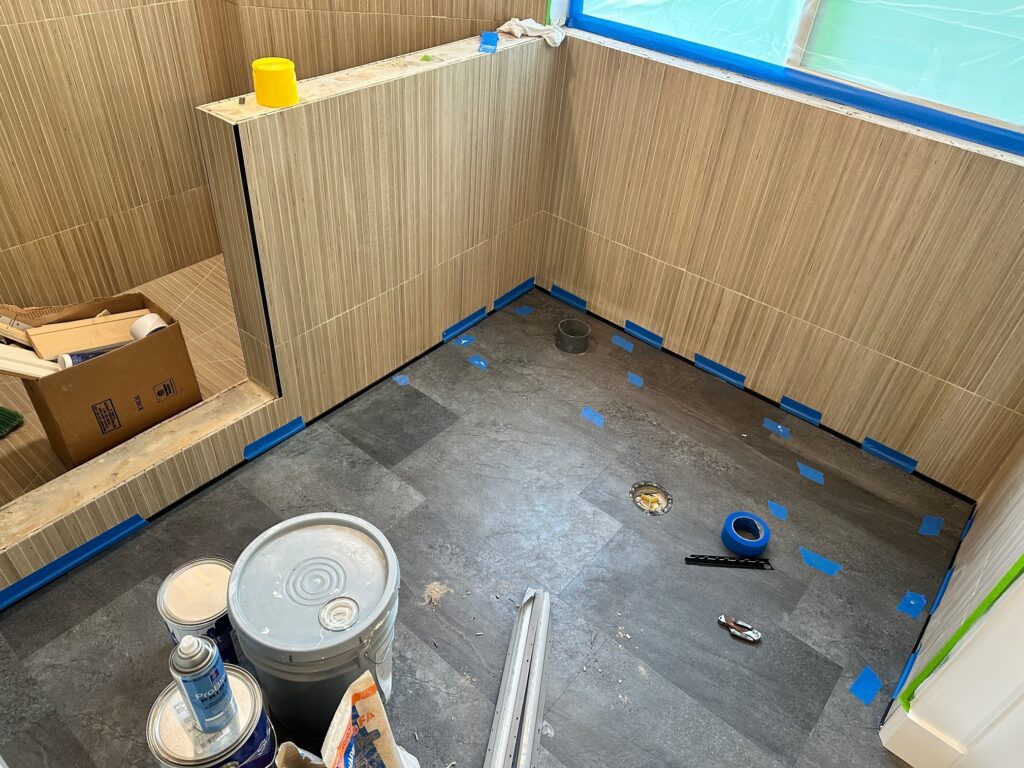 The new floor tile is being installed in this master bathroom remodel in Pleasant Grove, Utah. 