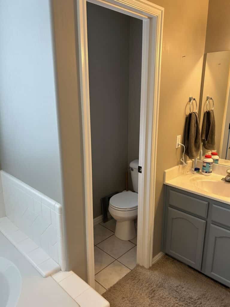 Toilet and vanity before being remodeled by Allied Remodeling Contractors. 