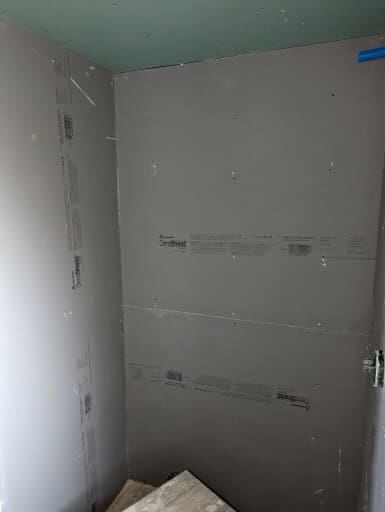 New drywall is up and our general contractor is ready to move the team on to the next step in this modern shower remodel. 