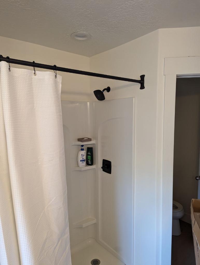 This is a shower insert with shelving for shampoo and soaps. Completed by Allied Remodleing Contractors.