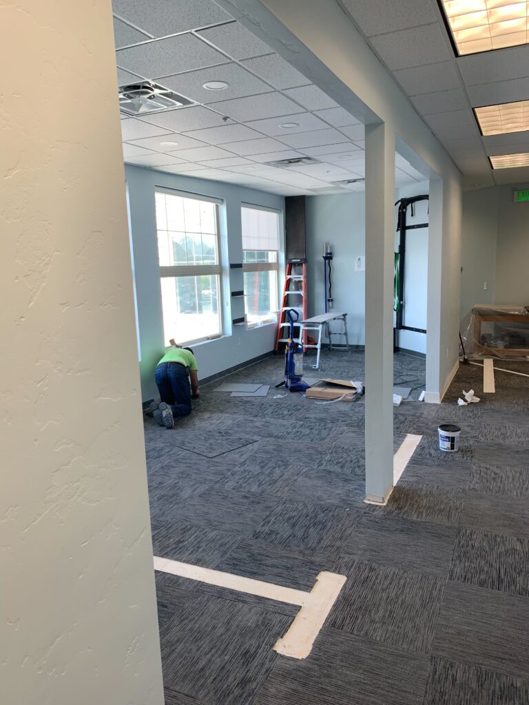 Walls to private rooms have been removed and we are laying new carpet throughout the office space. 